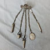 Sewing Interest - a 19th century Continental white metal chatelaine with sewing appendages such as