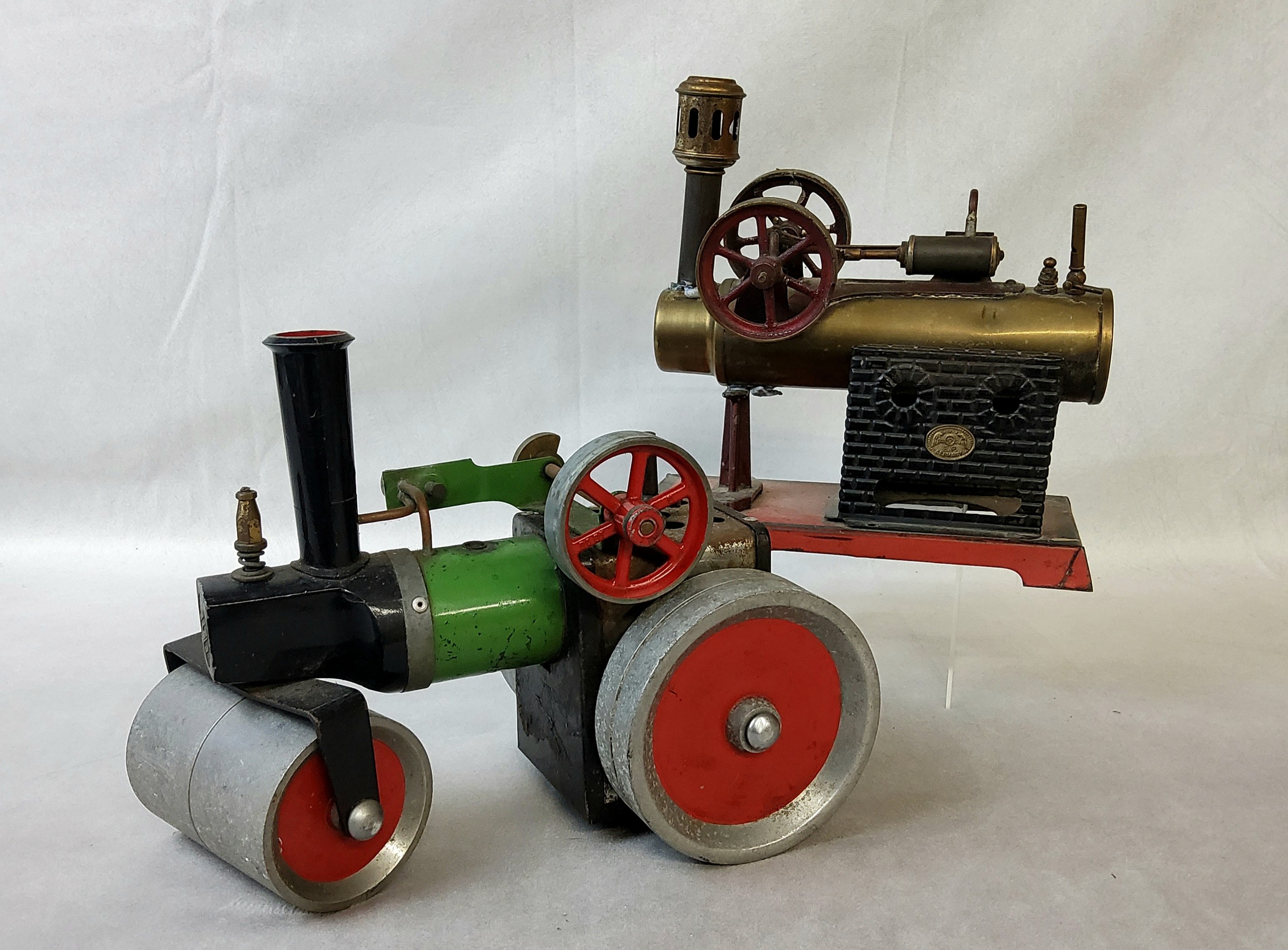 A Josef Falk over-type live steam engine, 29 x 14 cm (af); a Mamod live steam road roller (af)