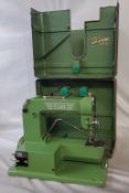 A vintage Swiss ELNA "Grasshopper" tinplate sewing machine, by Tavaro S.A. Geneva, (type 500890)
