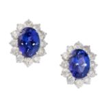 A PAIR OF TANZANITE AND DIAMOND CLUSTER STUD EARRINGS in 18ct white gold, each set with an oval