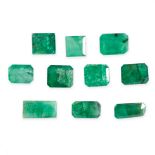 A MIXED LOT OF UNMOUNTED EMERALDS step cut, 10.6 carats.