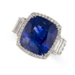 A LARGE SAPPHIRE AND DIAMOND RING in 18ct white gold, set with a cushion cut blue sapphire of 14.