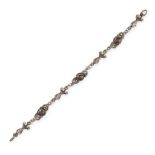 AN ANTIQUE GARNET BRACELET in silver, set with three round cabochon garnets accented by foliate