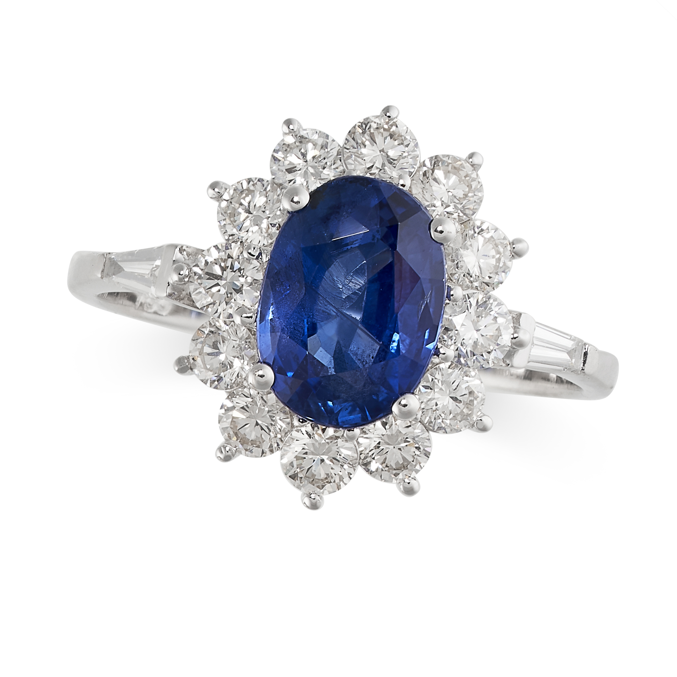A SAPPHIRE AND DIAMOND CLUSTER RING in 18ct white gold, set with an oval cut blue sapphire of 2.14