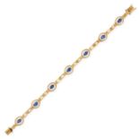 A SAPPHIRE AND DIAMOND BRACELET in 18ct yellow gold, set with seven oval cut blue sapphires