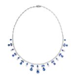 A SAPPHIRE AND DIAMOND FRINGE NECKLACE set with round brilliant cut diamonds, suspending pear cut