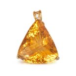 A CITRINE PENDANT in yellow gold, set with a triangular fancy cut citrine with a checkerboard cut