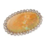 AN OPAL AND DIAMOND BROOCH set with a cabochon opal of 24.38 carats within a cluster of round cut