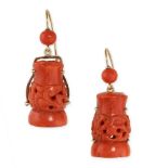 A PAIR OF ANTIQUE CARVED CORAL DROP EARRINGS in 18ct yellow gold, each set with a piece of coral