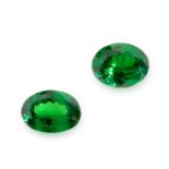 NO RESERVE - A PAIR OF UNMOUNTED GREEN GARNETS  Oval cut, 1.85 carats