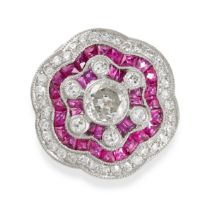 A RUBY AND DIAMOND DRESS RING set with a principal old cut diamond of approximately 0.55 carats in a
