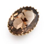 A VINTAGE SMOKY QUARTZ COCKTAIL RING, 1976 in 9ct yellow gold, set with an oval cut smoky quartz,