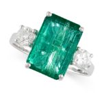 AN EMERALD AND DIAMOND THREE STONE RING set with a step cut emerald of 4.64 carats between two