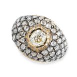 A DIAMOND BOMBE RING set with a central cushion cut yellow diamond of 1.33 carats within a border