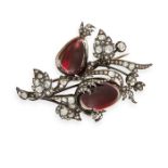 AN ANTIQUE DIAMOND AND GARNET BROOCH in yellow gold and silver, set with two cabochon garnets