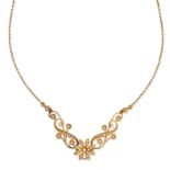 AN ANTIQUE PEARL NECKLACE, CIRCA 1900 in 15ct yellow gold, formed of floral and scrolling links