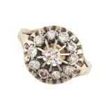 A DIAMOND CLUSTER DRESS RING in 18ct yellow gold, set with round brilliant cut diamonds, stamped