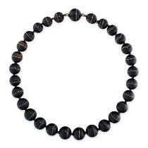 A BANDED AGATE BEAD NECKLACE comprising a single row of twenty-nine graduated polished banded