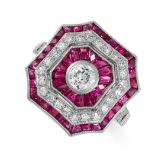 A RUBY AND DIAMOND DRESS RING the octagonal face set with a central old cut diamond of approximately