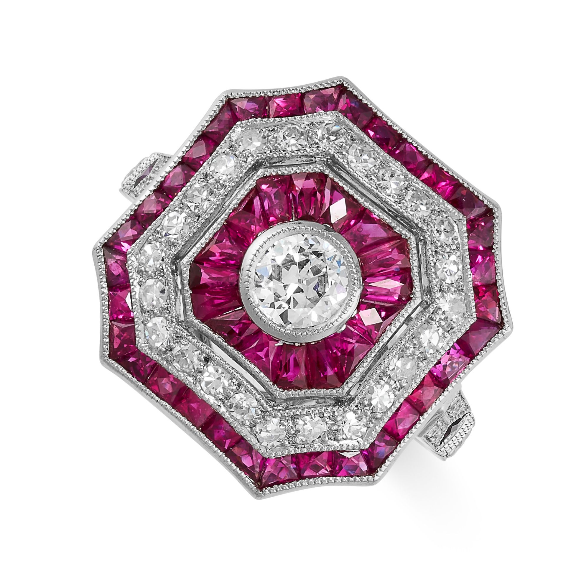 A RUBY AND DIAMOND DRESS RING the octagonal face set with a central old cut diamond of approximately