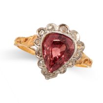 A PINK ZIRCON AND DIAMOND RING in yellow gold and silver, set with a pear cut pink zircon of 3.04