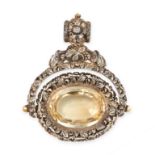 AN ANTIQUE CITRINE FOB SEAL PENDANT in silver, the body with high relief foliage and scrolls, with a