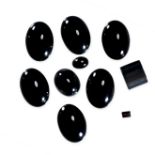 A MIXED LOT OF UNMOUNTED CABOCHON BLACK ONYX totalling 36.90 carats.