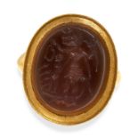 AN ANTIQUE GNOSTIC ABRAXAS INTAGLIO RING in 18ct yellow gold, set with a large oval hardstone,
