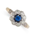 A SAPPHIRE AND DIAMOND CLUSTER RING set with a round cut sapphire of 0.61 carats in a cluster of