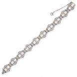 A DIAMOND BRACELET, CIRCA 1940 formed of a series of ten stylised openwork links, set throughout