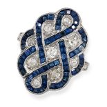 A SAPPHIRE AND DIAMOND RING set with eight old cut diamonds within scrolling design of step cut