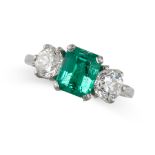 AN EMERALD AND DIAMOND THREE STONE RING in platinum, set with an emerald cut emerald of 1.67