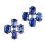 A PAIR OF SAPPHIRE AND DIAMOND STUD EARRINGS each set with four oval cut sapphires accented by a