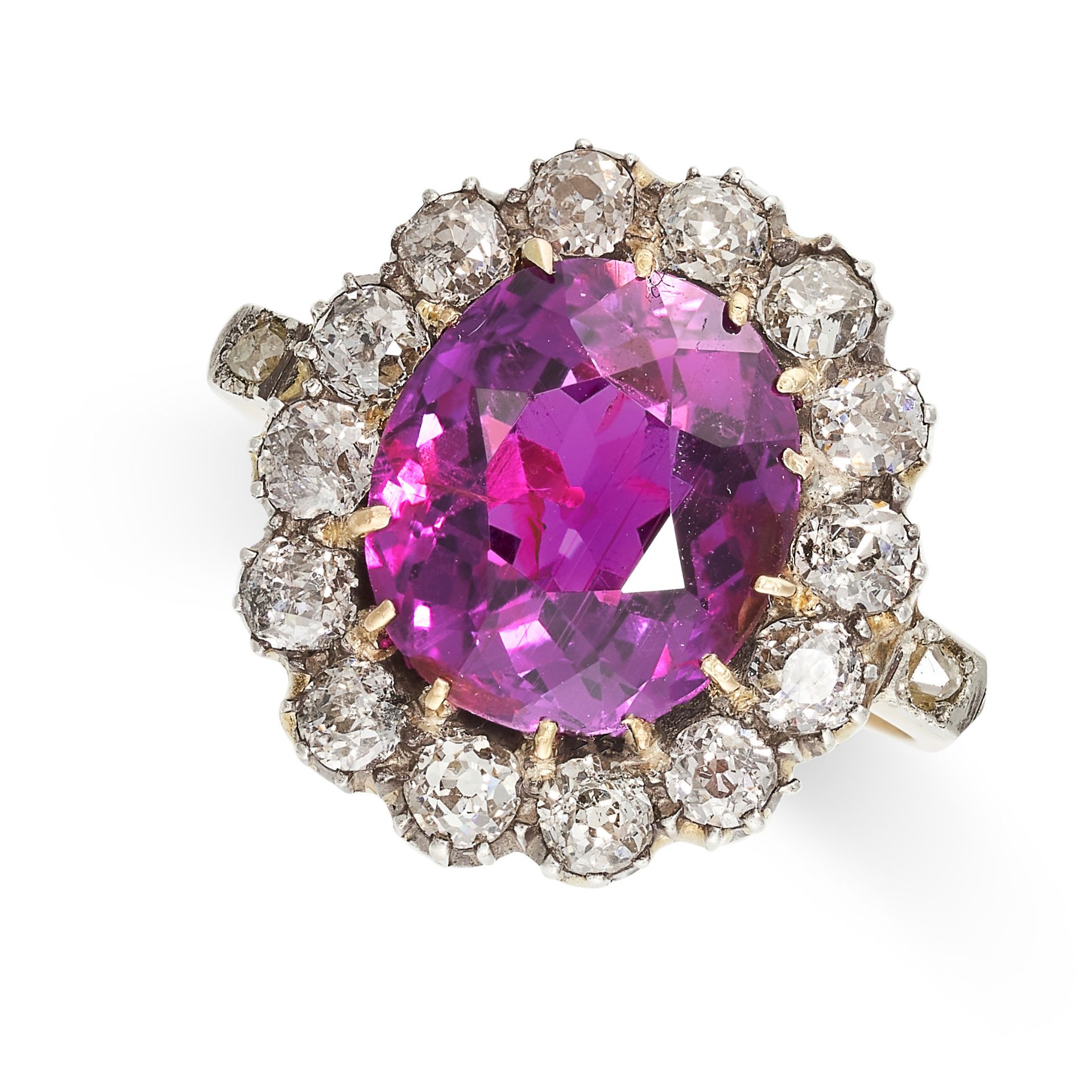 AN ANTIQUE UNHEATED RUBY AND DIAMOND RING in yellow gold, set with an oval cut ruby of 6.93 carats