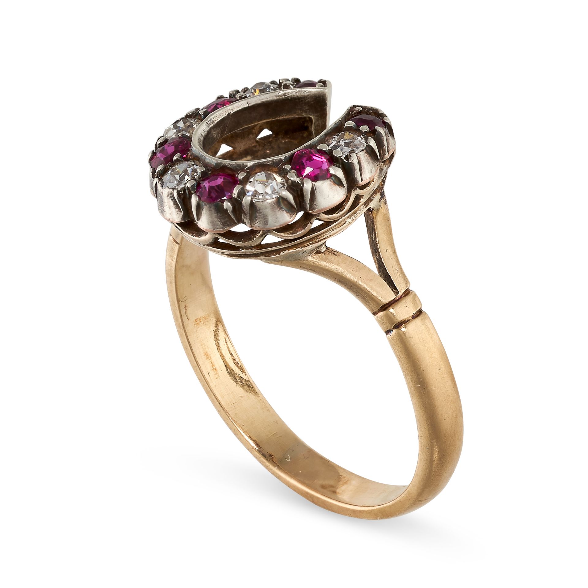 A RUBY AND DIAMOND HORSESHOE RING in yellow gold and silver, set with alternating round cut rubies - Bild 2 aus 2