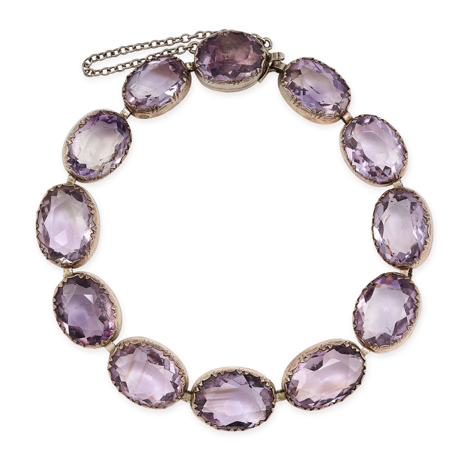 AN ANTIQUE AMETHYST BRACELET in silver, set with a single row of oval cut amethysts, stamped 935,