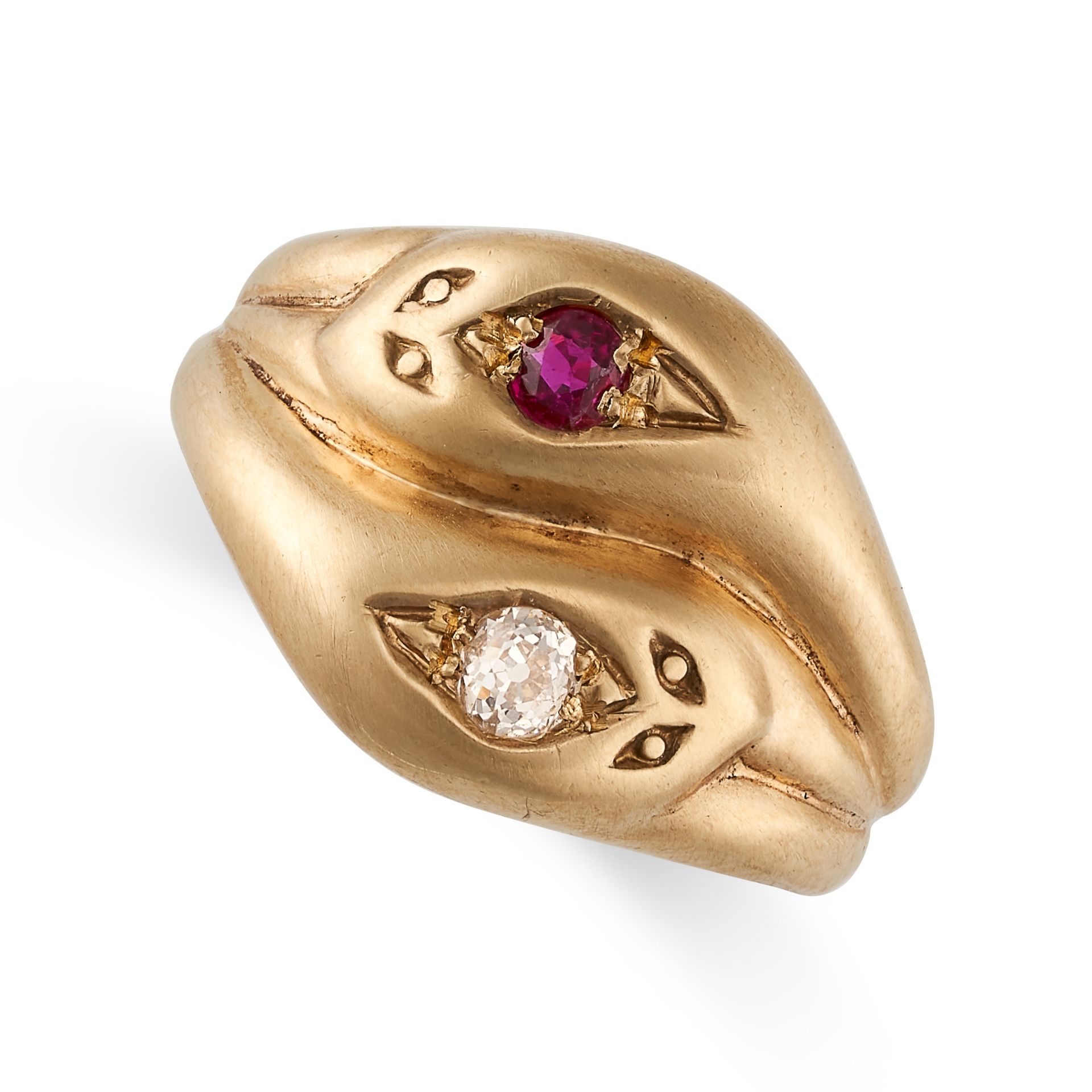 A RUBY AND DIAMOND SNAKE RING in 9ct yellow gold, designed as two intertwined snakes, set with a