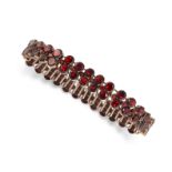 AN ANTIQUE GARNET BRACELET formed of a series of articulated links set with two rows of round cut