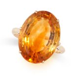 A VINTAGE CITRINE RING in 18ct yellow gold, set with an oval cut citrine of approximately 12.66