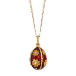 AN ENAMEL EGG PENDANT AND CHAIN the pendant set with red and white enamel and floral motifs, on a