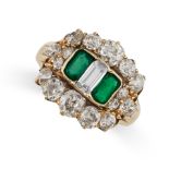 AN ANTIQUE EMERALD AND DIAMOND RING in yellow gold, comprising a central step cut diamond between