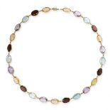 A GEMSET HARLEQUIN NECKLACE in 18ct yellow gold, set with a row of oval cut garnets, citrines,