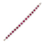 A FINE RUBY AND DIAMOND BRACELET in 18ct white gold, set with a row of sixteen graduated oval cut