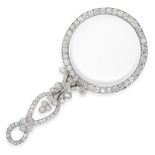 A DIAMOND LOOKING GLASS, EARLY 20TH CENTURY the circular lens within a border of old cut diamonds,