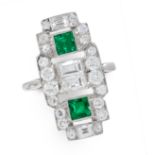 AN EMERALD AND DIAMOND DRESS RING set with two square step cut emeralds and four baguette cut