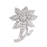 A VINTAGE DIAMOND FLOWER BROOCH designed as a flower, set to the centre with a round brilliant cut