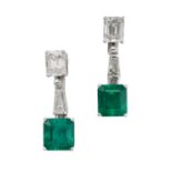 A PAIR OF FINE EMERALD AND DIAMOND EARRINGS in 18ct white gold, each set with an emerald cut