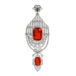 AN IMPORTANT BELLE EPOQUE FIRE OPAL AND DIAMOND PENDANT in platinum, set with two cushion cut fire