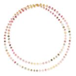 A TOURMALINE BEAD SAUTOIR NECKLACE in 18ct yellow gold, comprising a row of faceted purple, pink,