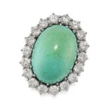 A TURQUOISE AND DIAMOND CLUSTER RING in 18ct white gold, set with a large oval cabochon turquoise of